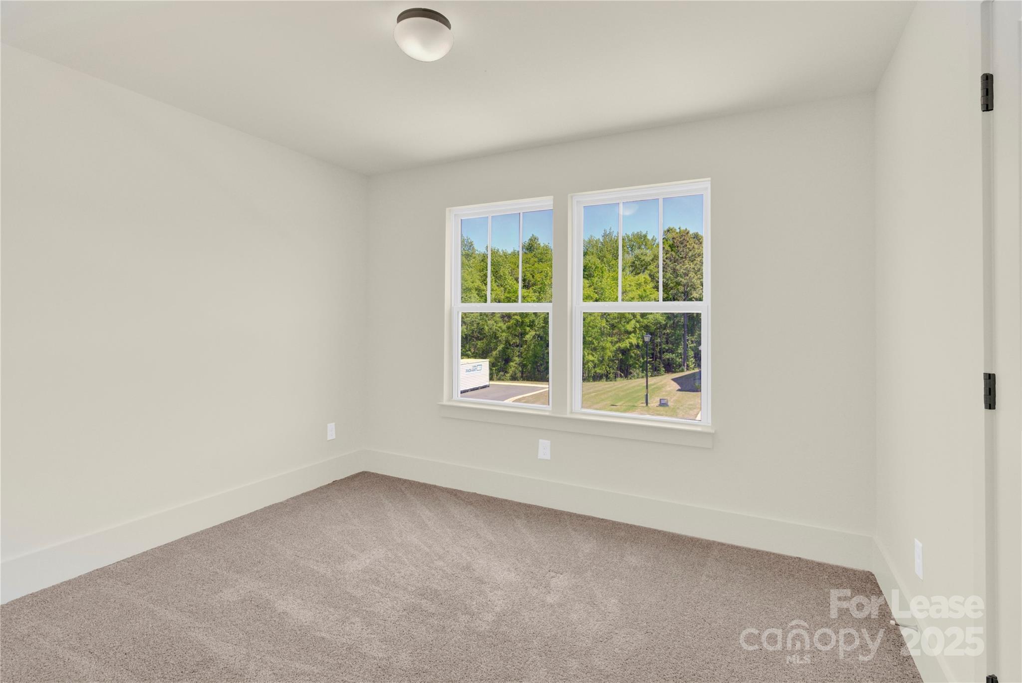 207 Aspire Circle, Unit 46 Wingate, NC 28174 - Photo 29 of 34 an empty room with a window