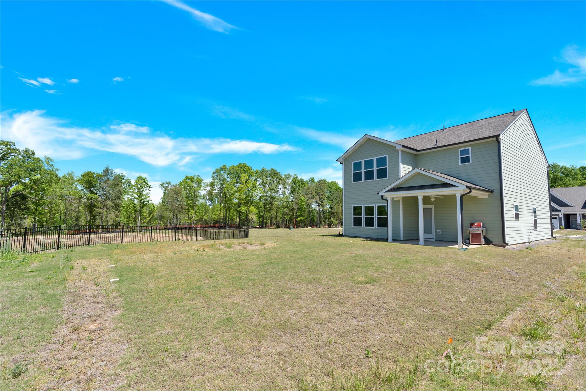 207 Aspire Circle, Unit 46 Wingate, NC 28174 - Photo 33 of 34 a view of a house with a big yard