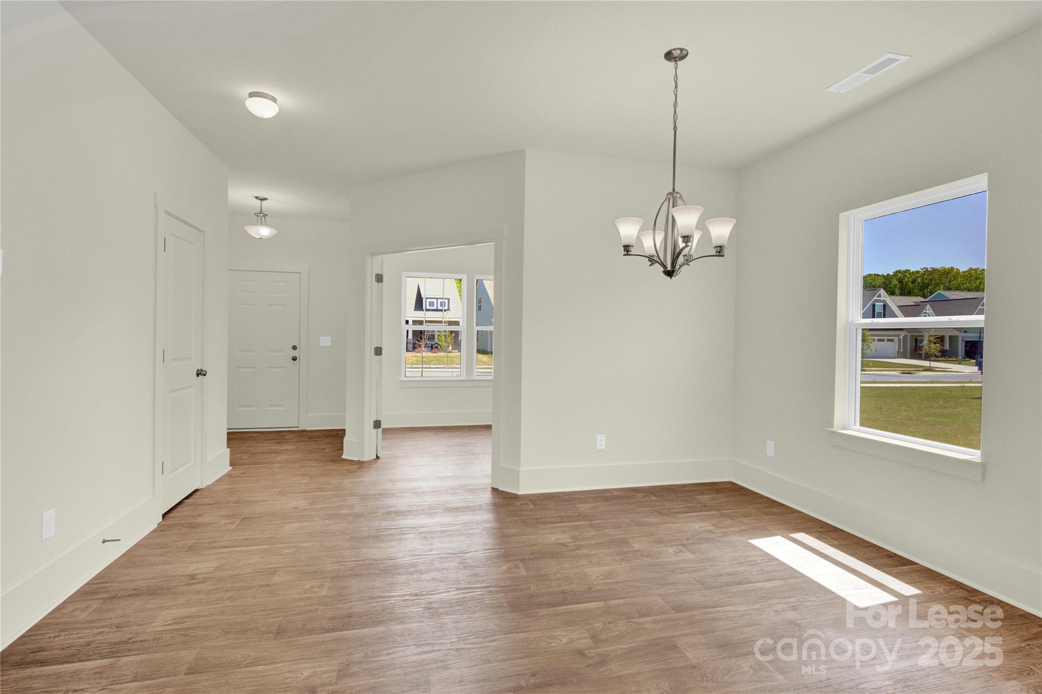 207 Aspire Circle, Unit 46 Wingate, NC 28174 - Photo 5 of 34 a view of an empty room with a window