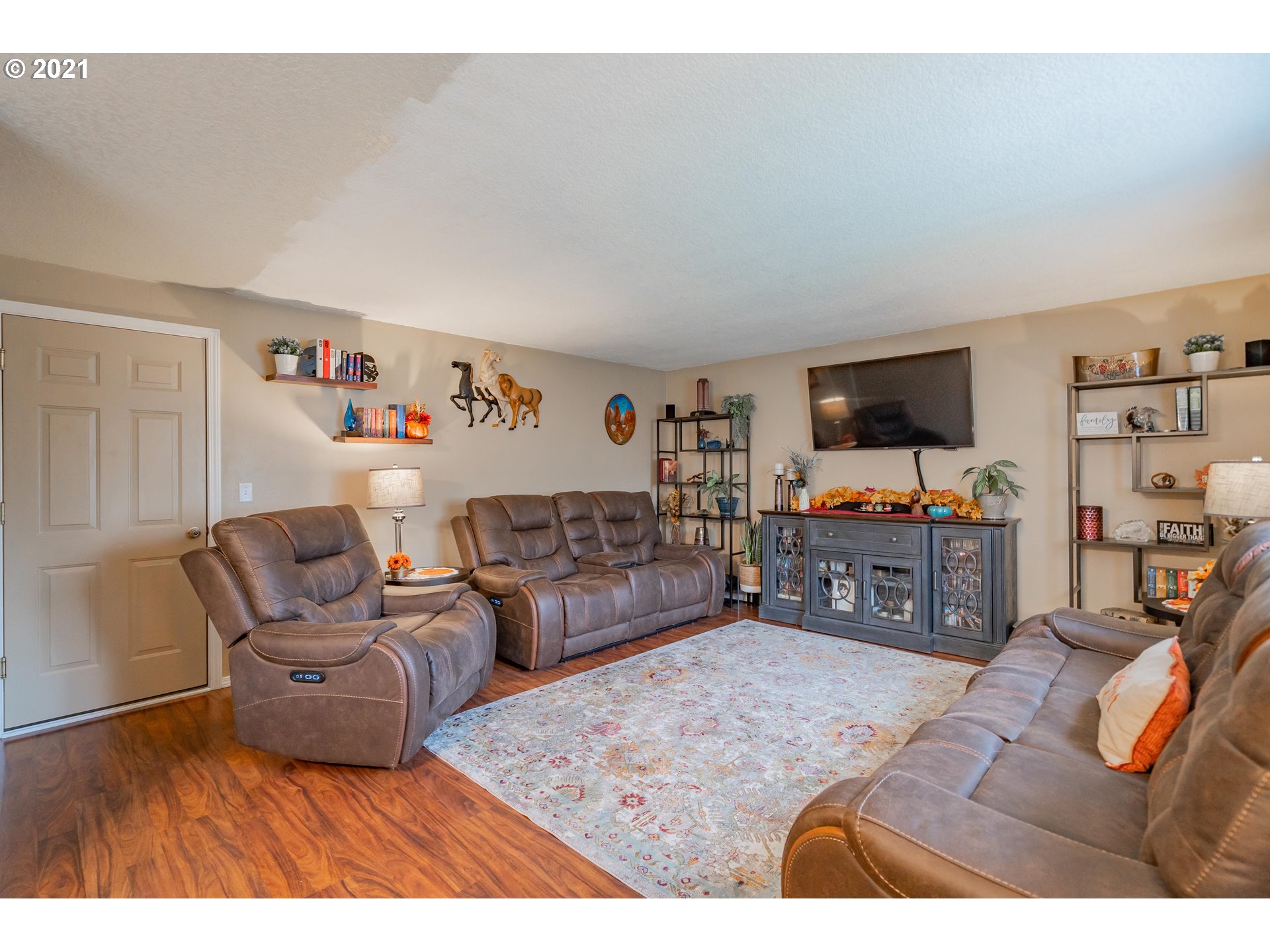 2051 North 9th Way Ridgefield, WA 98642 - Photo 14 of 32 a living room with furniture and a flat screen tv