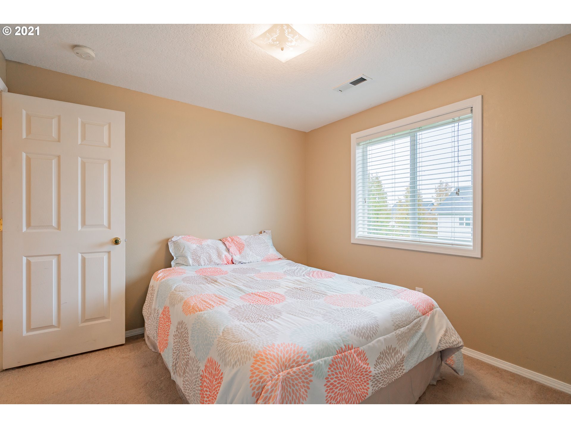 2051 North 9th Way Ridgefield, WA 98642 - Photo 22 of 32 a bedroom with a bed and a window