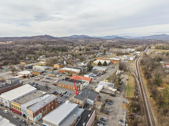 an aerial view of residential house with parking and space
