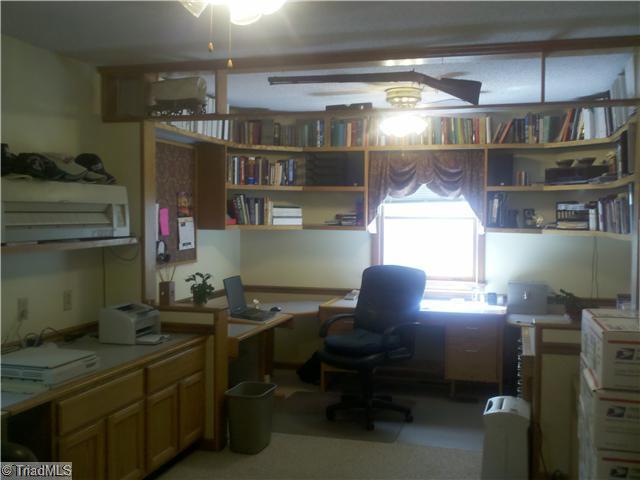 205 Mersey Road Greensboro, NC 27406 - Photo 6 of 12 Studio/Study/Office. Bonus Room on main with custom built in desks and storage units perfect for home based business, has a private entrance