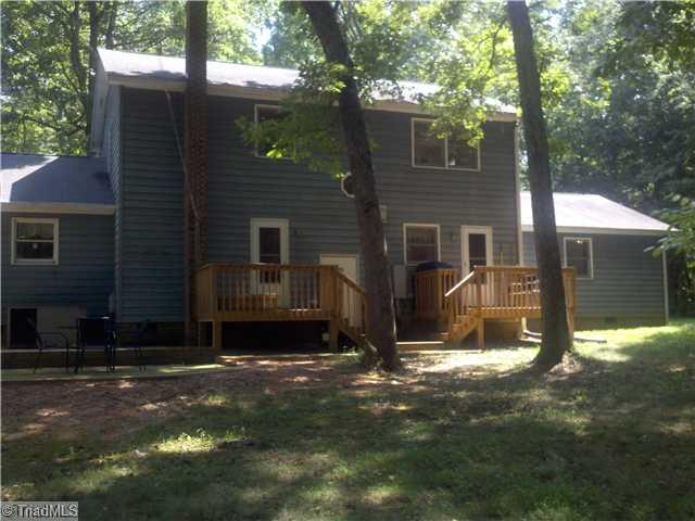 205 Mersey Road Greensboro, NC 27406 - Photo 10 of 12 Exterior Back. The decks and patio were added in 2009