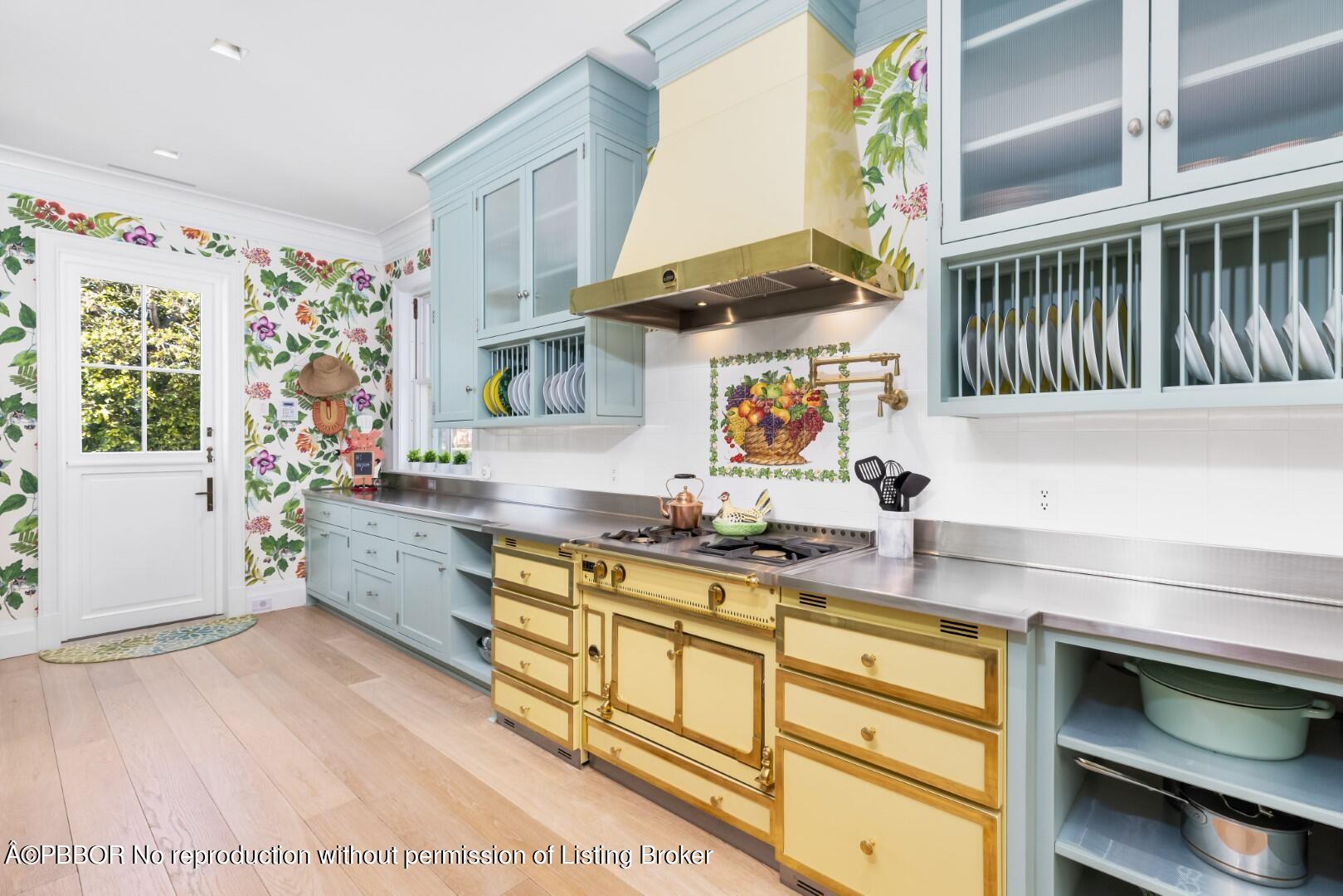 710 South County Road Palm Beach, FL 33480 - Photo 23 of 69 a kitchen with a sink a stove cabinets and a window