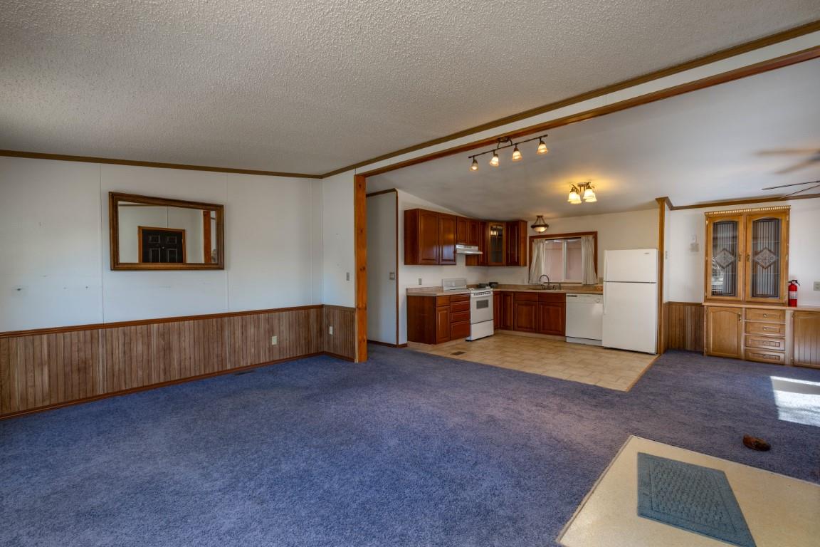 2908 East 7/8 Road Grand Junction, CO 81504 - Photo 7 of 26 a view of kitchen with furniture and wooden floor
