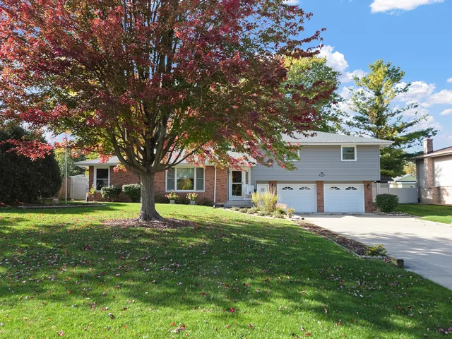 a house view with a sitting space and garden