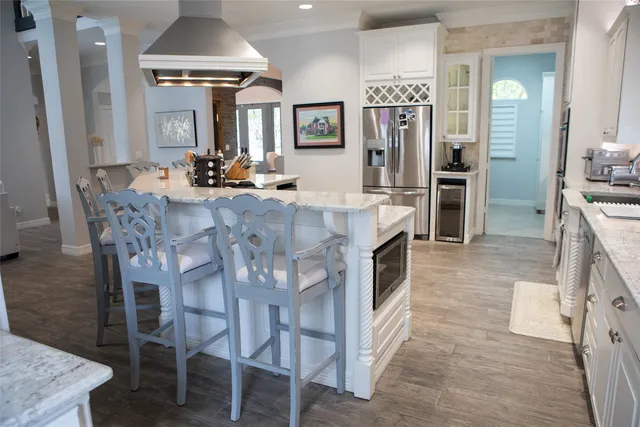 a view of a dining room kitchen and a chandelier