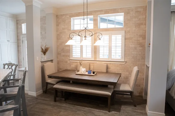 a dining room with furniture and window