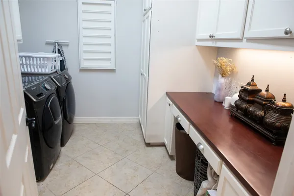 a utility room with closet dryer and washer