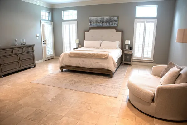 a bedroom with a bed and couch