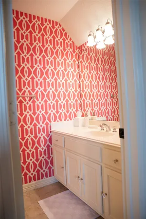 a bathroom with a sink and a mirror