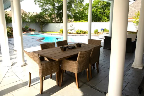 a view of a dining room with furniture and window
