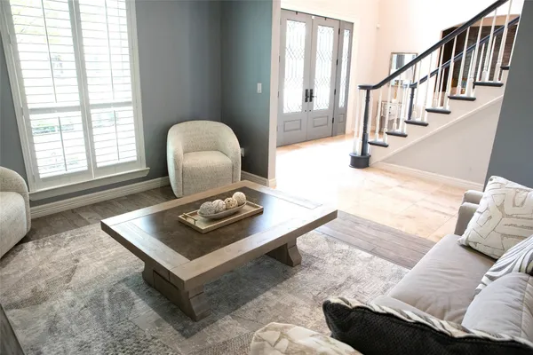 a living room with furniture and a window