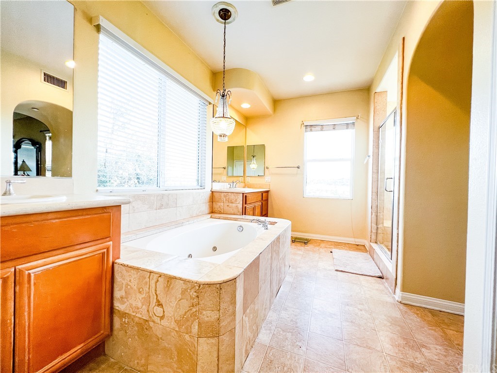 2018 Ford Lane Placentia, CA 92870 - Photo 12 of 16 a bathroom with a tub sink and mirror