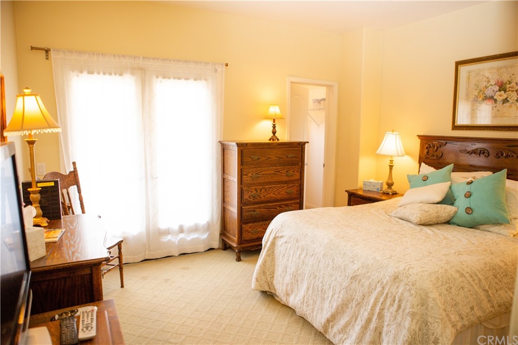 2018 Ford Lane Placentia, CA 92870 - Photo 13 of 16 a bedroom with a bed and wooden floor