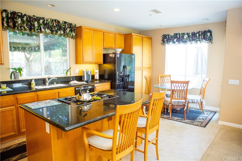2018 Ford Lane Placentia, CA 92870 - Photo 5 of 16 a view of a dining room with furniture a chandelier and large windows