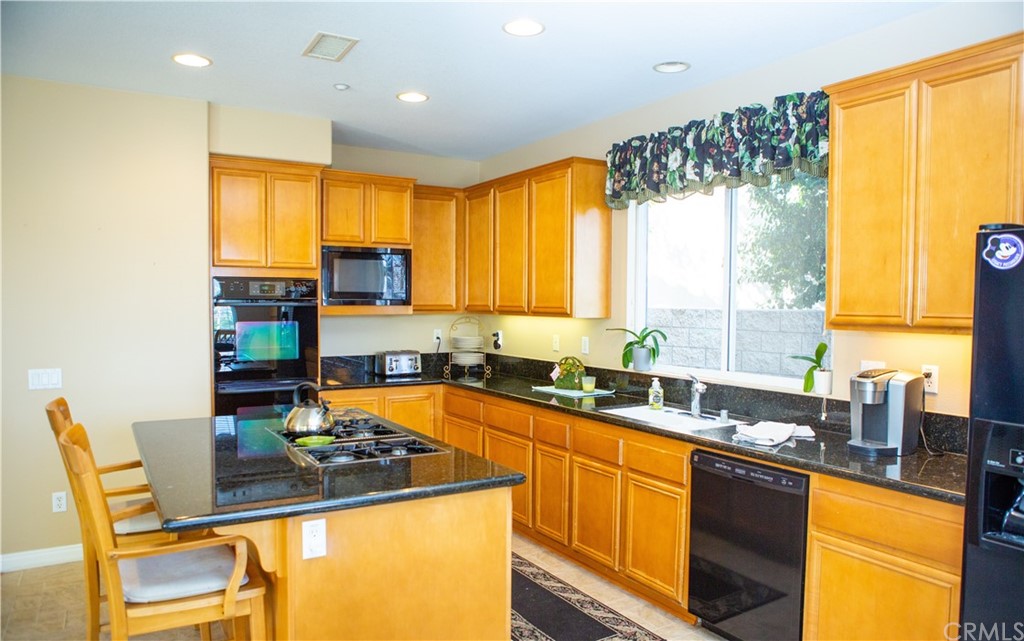 2018 Ford Lane Placentia, CA 92870 - Photo 6 of 16 a kitchen with a sink a counter top space and appliances
