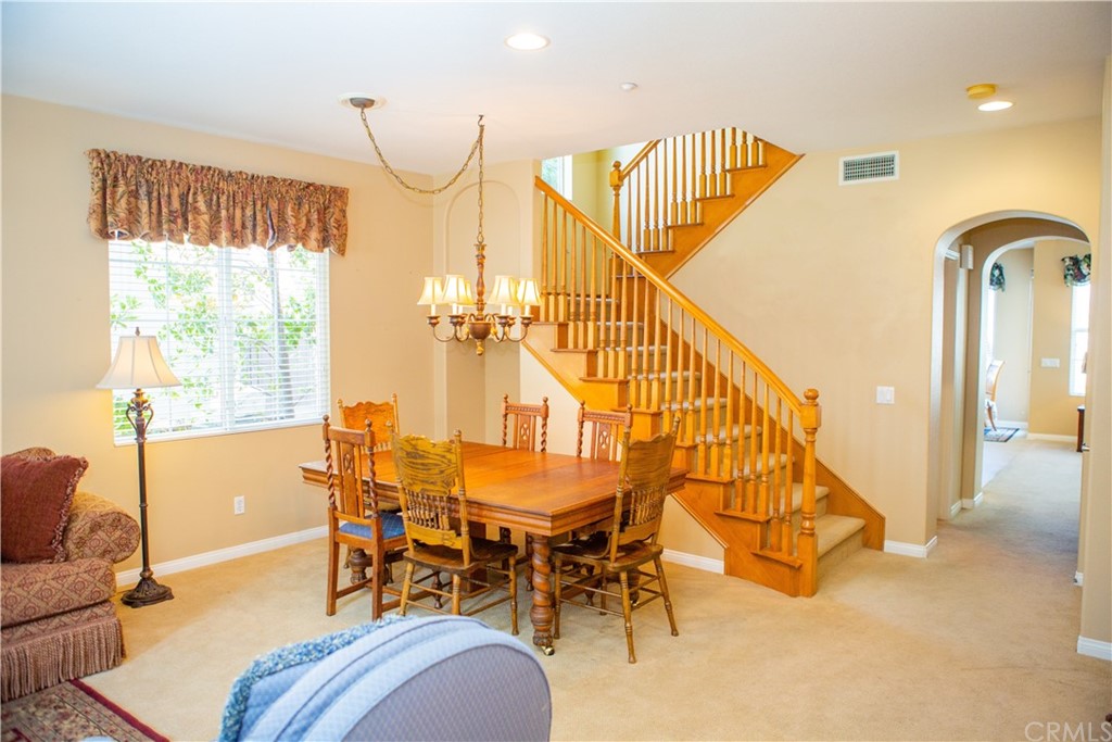 2018 Ford Lane Placentia, CA 92870 - Photo 8 of 16 a dining room with furniture and a chandelier