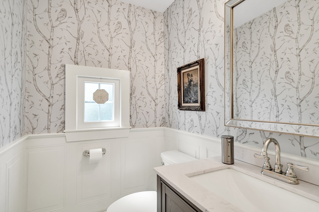 83 Ames Street Dedham, MA 02026 - Photo 13 of 33 a bathroom with a sink and a toilet