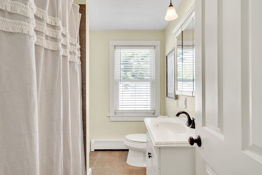 83 Ames Street Dedham, MA 02026 - Photo 23 of 33 a bathroom with a sink and a toilet