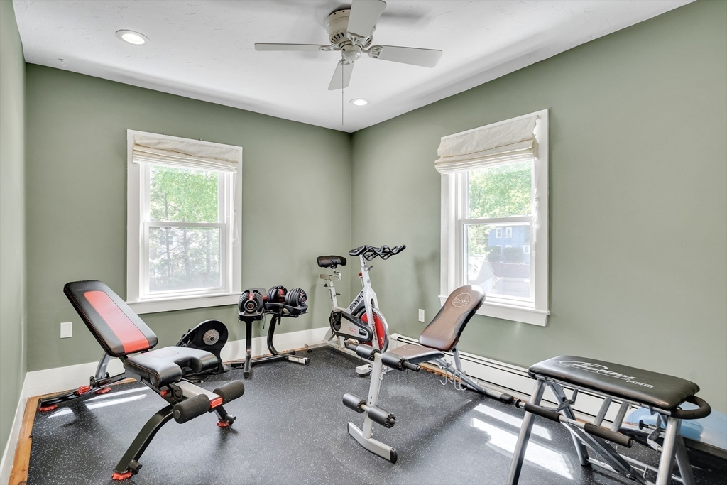 83 Ames Street Dedham, MA 02026 - Photo 27 of 33 a living room with furniture a air conditioner vent and a window