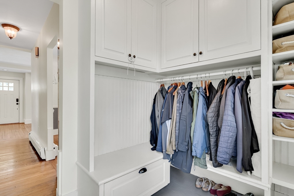 83 Ames Street Dedham, MA 02026 - Photo 3 of 33 a view of walk in closet with clothes and shoes