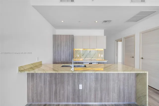 a view of kitchen with wooden floor