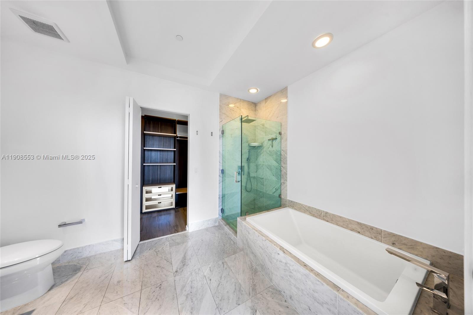 801 South Miami Avenue, Unit 5204 Miami, FL 33131 - Photo 14 of 31 a bathroom with a toilet and a shower