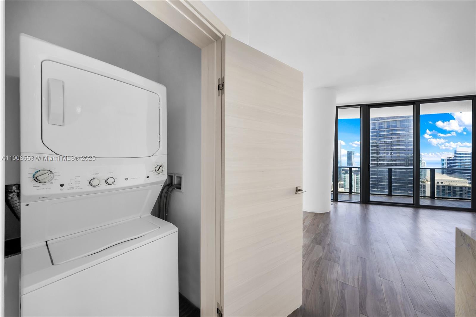 801 South Miami Avenue, Unit 5204 Miami, FL 33131 - Photo 25 of 31 a view of washer and dryer with wooden floor