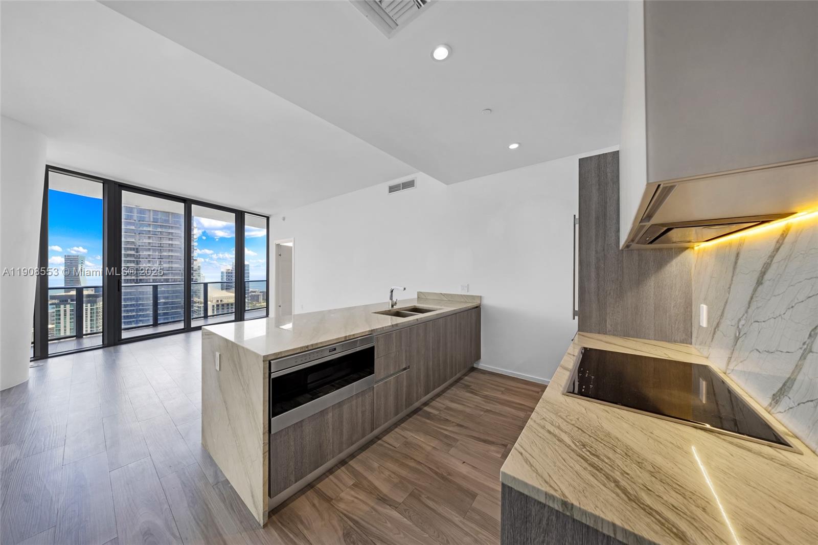 801 South Miami Avenue, Unit 5204 Miami, FL 33131 - Photo 5 of 31 a large white room with a large window