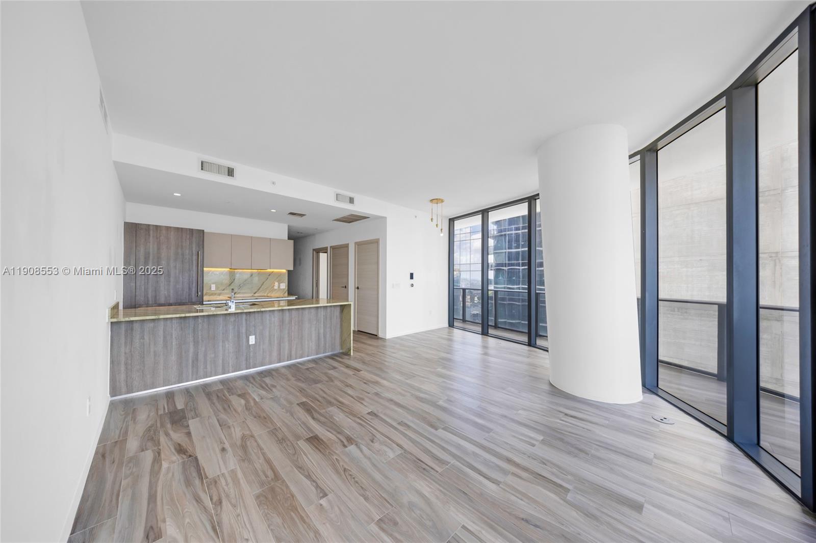 801 South Miami Avenue, Unit 5204 Miami, FL 33131 - Photo 10 of 31 a view of a room with wooden floor and window