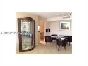 9195 Collins Avenue, Unit 614 Surfside, FL 33154 - Photo 4 of 12 a living room with furniture