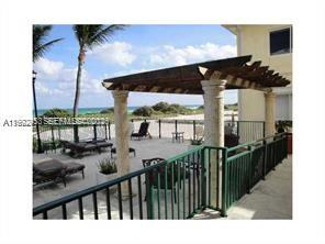 9195 Collins Avenue, Unit 614 Surfside, FL 33154 - Photo 10 of 12 a view of a balcony with chairs