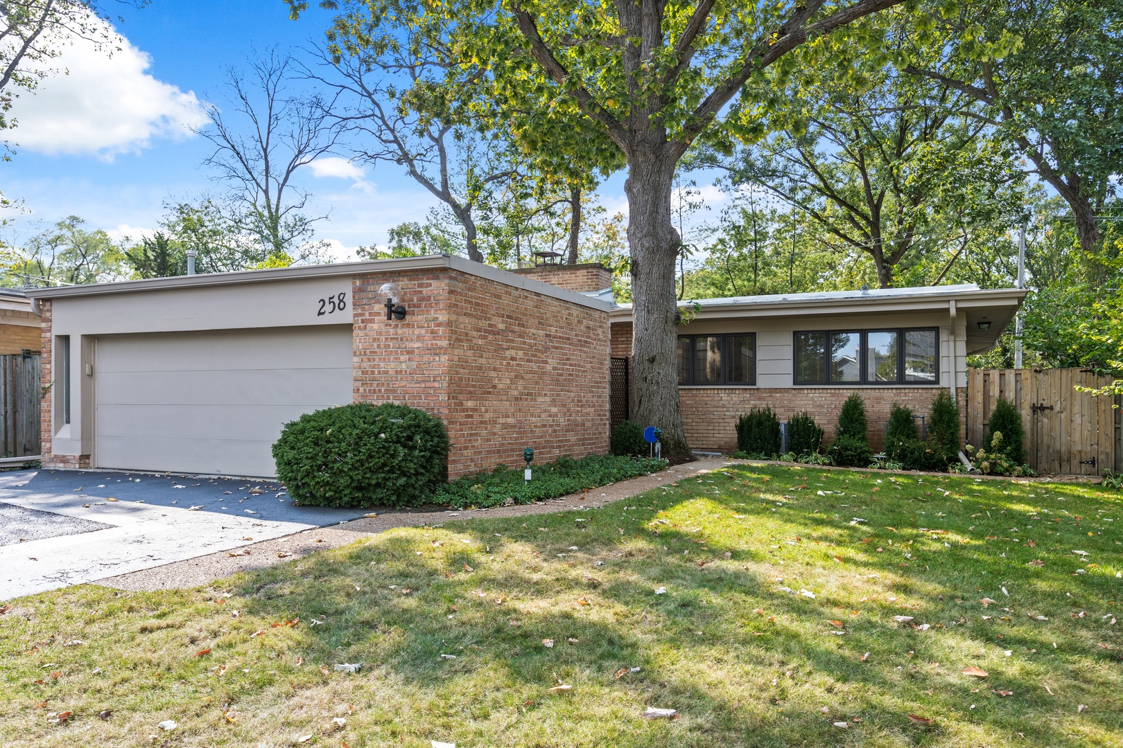 258 Wagner Road Northfield, IL 60093 - Photo 1 of 17 a view of an house with backyard space and garden