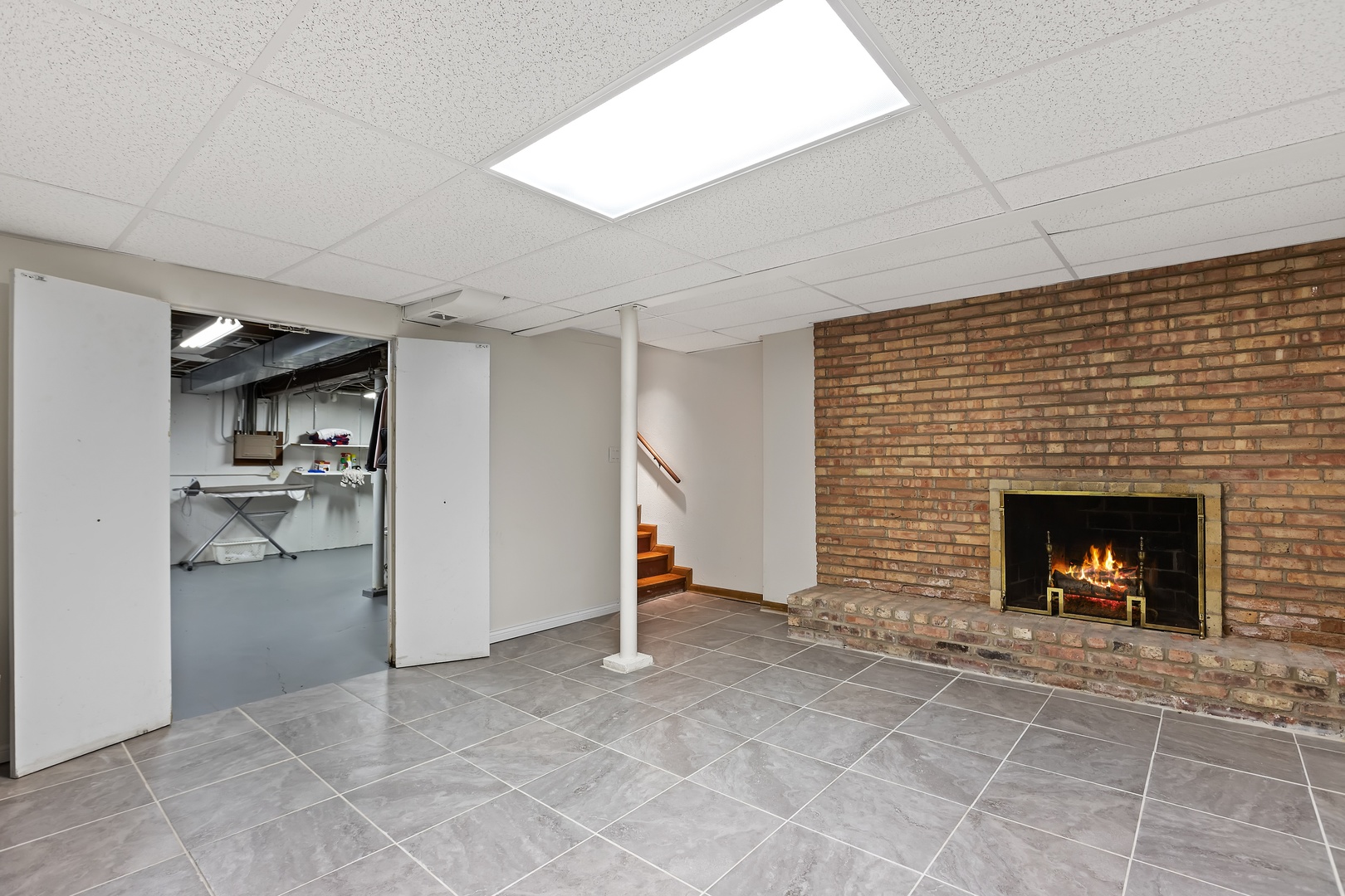 258 Wagner Road Northfield, IL 60093 - Photo 12 of 17 a view of a livingroom with a chair and a fireplace