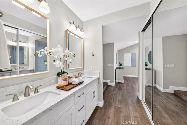 a kitchen with stainless steel appliances kitchen island granite countertop a stove a sink a dining table and chairs