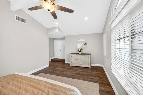 a kitchen with granite countertop a sink and a white wooden cabinets