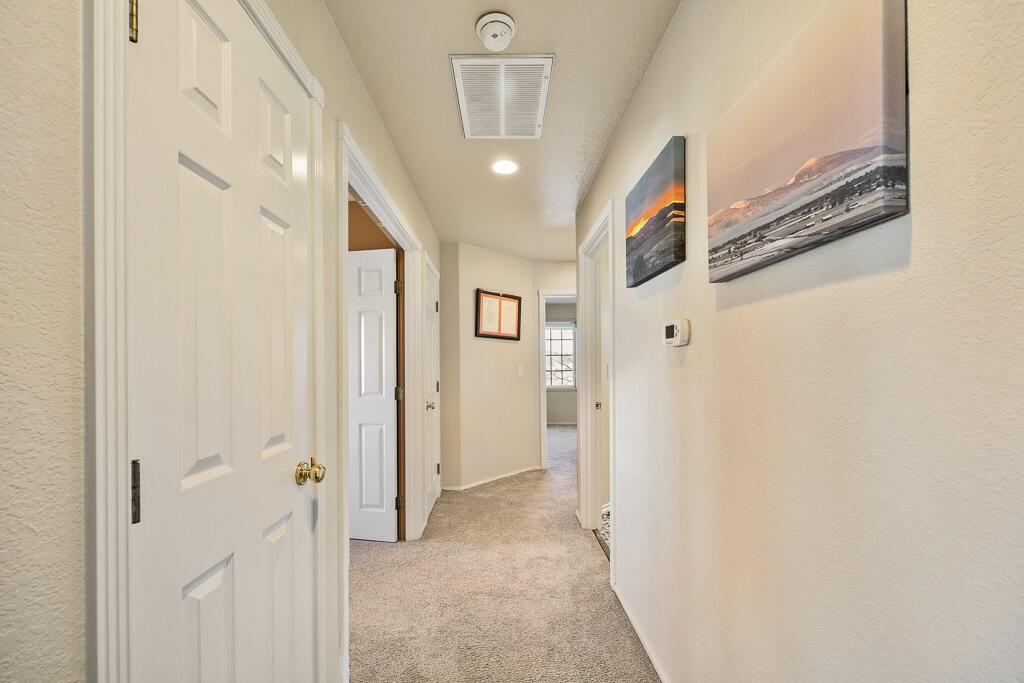 13351 Crystal Springs Road Klamath Falls, OR 97603 - Photo 35 of 51 a view of a hallway with wooden floor and staircase