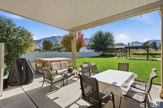 1447 Meadow Lane Mapleton, UT 84664 - Photo 39 of 67 Covered patio featuring concrete flooring and a white vinyl privacy fence