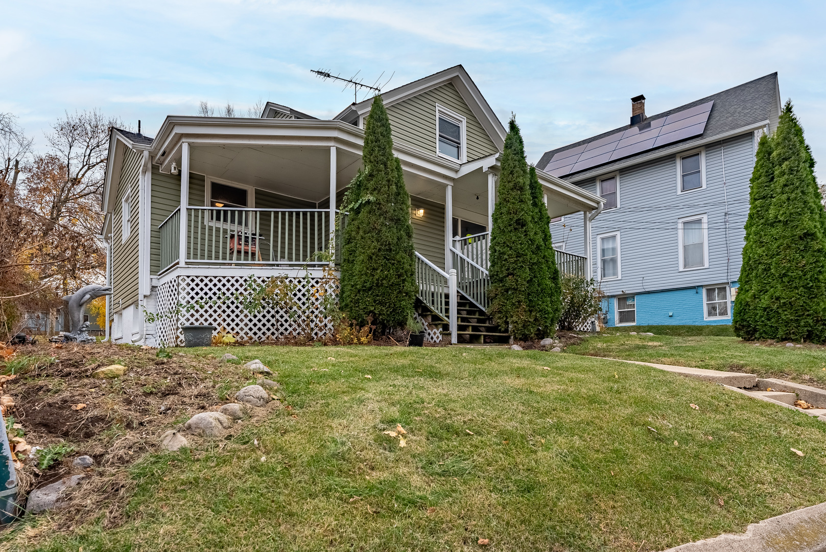 643 Wing Street Elgin, IL 60123 - Photo 2 of 19 a front view of a house with a garden