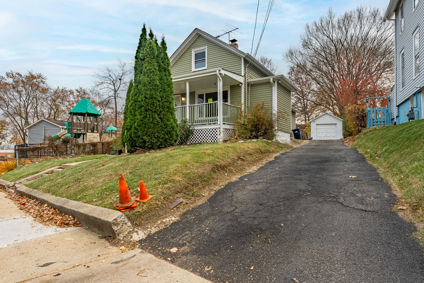 643 Wing Street Elgin, IL 60123 - Photo 3 of 19 a front view of a house with a yard