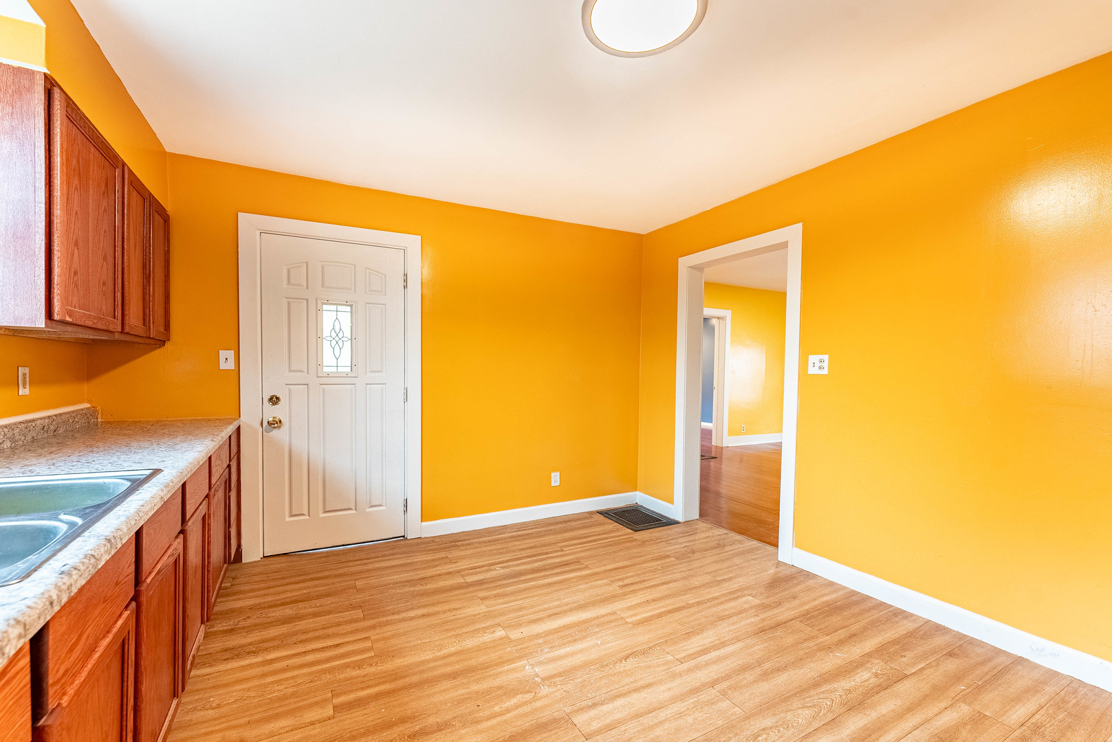643 Wing Street Elgin, IL 60123 - Photo 9 of 19 a view of a room with wooden floor and staircase