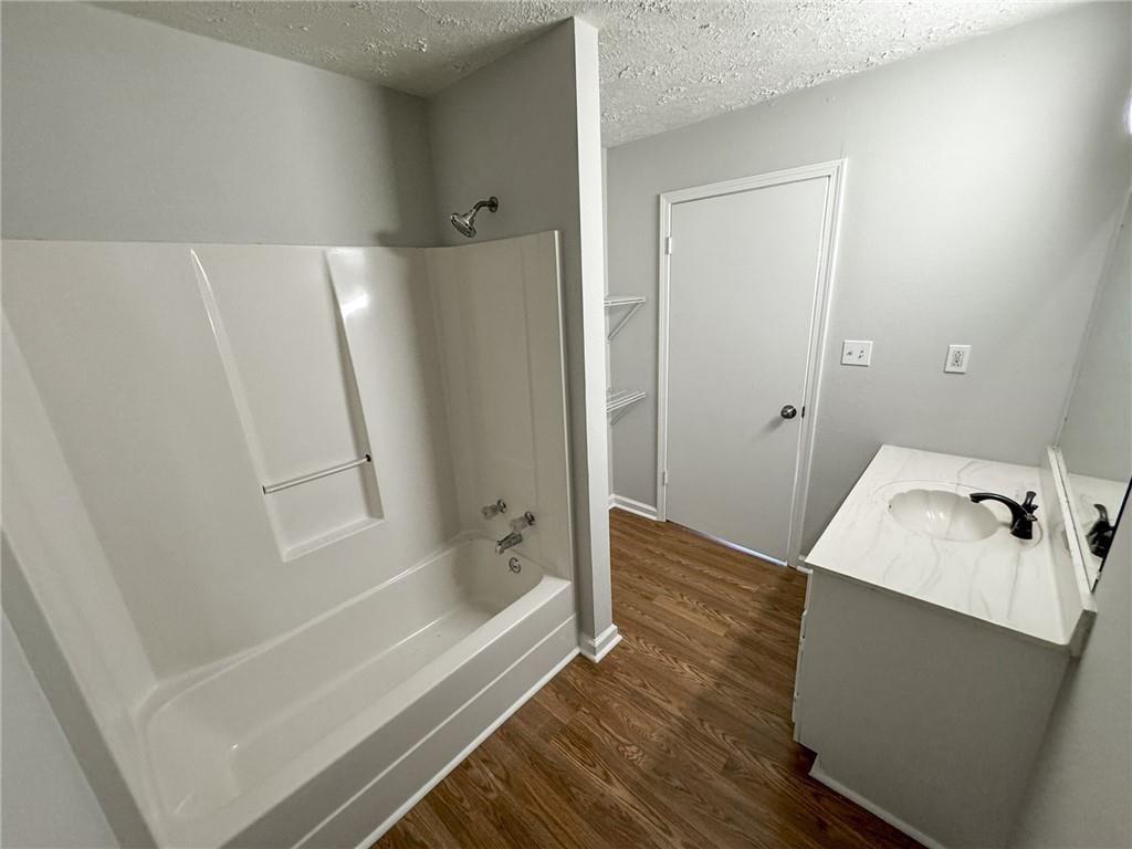 774 Mill Road McDonough, GA 30253 - Photo 15 of 37 a bathroom with a bathtub and shower