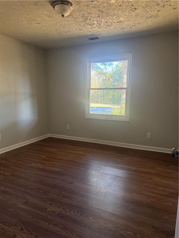 774 Mill Road McDonough, GA 30253 - Photo 19 of 37 an empty room with wooden floor and windows