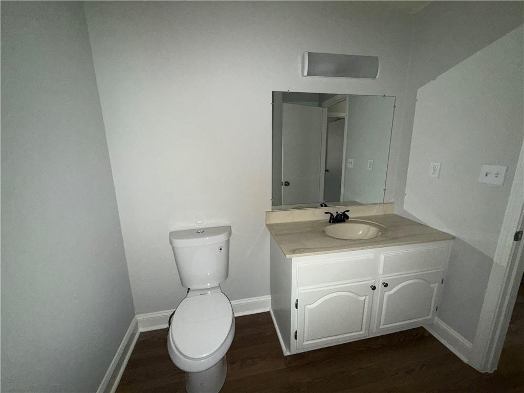 774 Mill Road McDonough, GA 30253 - Photo 28 of 37 a bathroom with a toilet sink and mirror