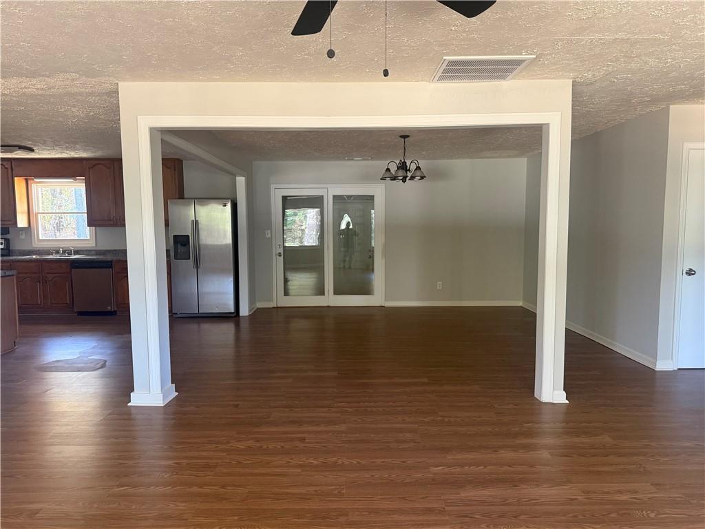 774 Mill Road McDonough, GA 30253 - Photo 3 of 37 a view of a hallway with wooden floor