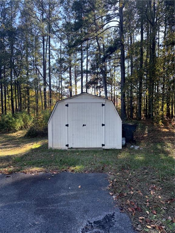 774 Mill Road McDonough, GA 30253 - Photo 32 of 37 a backyard of a house with lots of green space