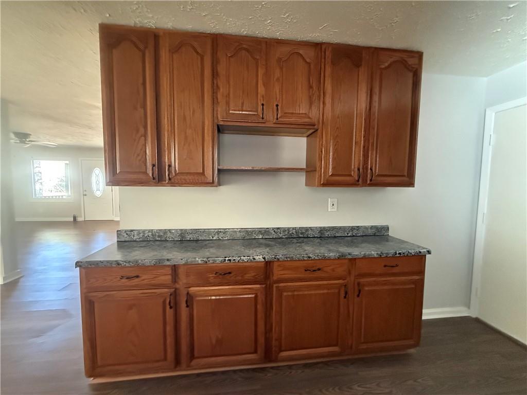 774 Mill Road McDonough, GA 30253 - Photo 10 of 37 a kitchen with granite countertop wooden cabinets