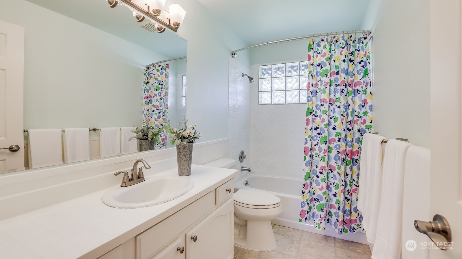 4324 Northeast 11th Street Renton, WA 98059 - Photo 13 of 22 a bathroom with a sink toilet and shower